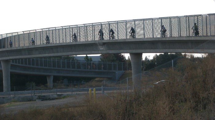 Bicyclists crossing Interstate 80 on the new bridge
