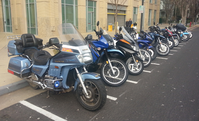 Line of motorcycles parked in front of City Hall