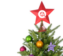 christmas tree with recycle logo on star topper